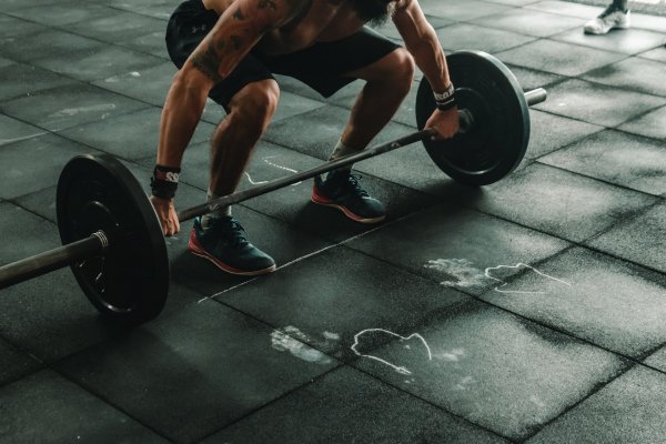 person getting ready to lift weights